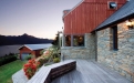 a wooden bench in front of a house