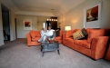 a large red chair in the living room