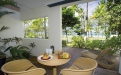 a dining room table in front of a window