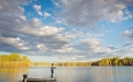 a group of clouds in the sky over a body of water