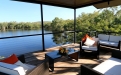 a view of a living room with a body of water