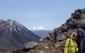 a man standing in front of a mountain