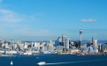 a large body of water with a city in the background