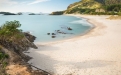 a beach next to a body of water