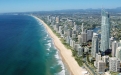 a large body of water with a city in the background