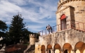 a person standing in front of a stone building