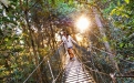 a man standing in a wooded area