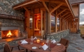 a fire place sitting in a living room with a stone fireplace