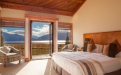 a bedroom with a large bed in a hotel room