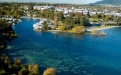 a large body of water with a city in the background