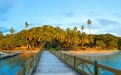 a wooden pier next to a body of water