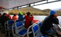 a group of people riding on the back of a boat