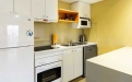 a white refrigerator freezer sitting inside of a kitchen