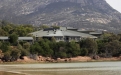 a view of water and a mountain in the background