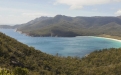 a body of water with a mountain in the background