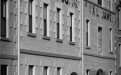 a black and white photo of a brick building