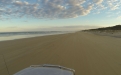 a view of a beach next to a body of water