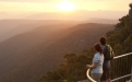 a person standing in front of a mountain