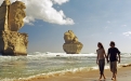 a group of people on a rocky beach