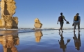 a couple of people that are standing in the water