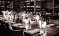 a dining room table filled with wine glasses