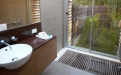 a white tub sitting next to a sink