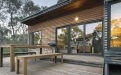 a wooden bench in front of a building