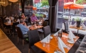 a group of people sitting at a table in a restaurant