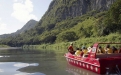 a person riding on the back of a boat in the water