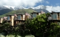 a house with a mountain in the background