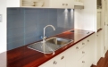 a kitchen with stainless steel appliances and wooden cabinets