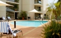 a dining room table in front of a pool