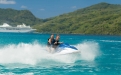 a man riding a wave on top of a mountain