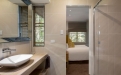 a large white tub next to a glass shower door