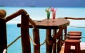 a wooden pier next to a body of water