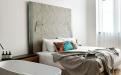 a bedroom with a bed and a mirror