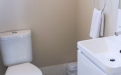 a white tub sitting next to a sink