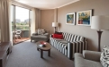 a living room filled with furniture and a flat screen tv