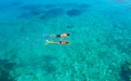 a person swimming in a body of water