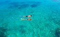 a person swimming in a body of water