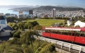 a passenger bus that is parked on the side of Wellington Cable Car