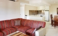 a large red chair in the living room