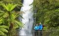 a person riding on the back of a waterfall