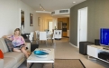 a living room filled with furniture and a flat screen tv