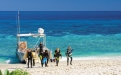 a group of people on a beach