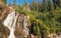 a large waterfall in a forest