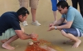 a group of people preparing food on a table