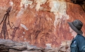 a man standing in front of a canyon