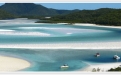 a body of water with a mountain in the background