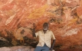 a man standing in front of a canyon